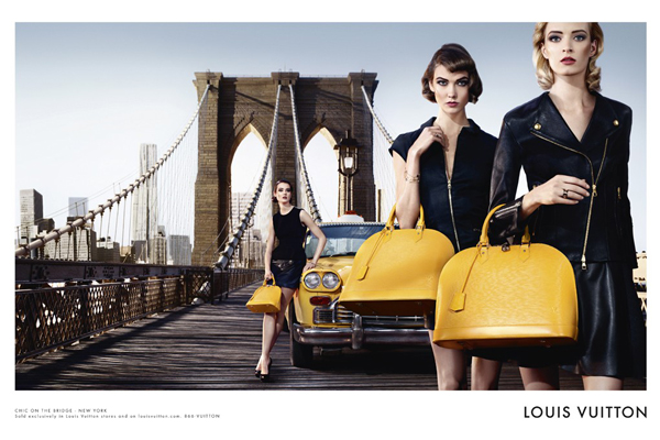 Karlie Kloss and Daria Strokous pose with Louis Vuitton's Alma bag